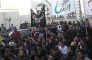 Demonstrators protest against Syria's President Bashar al-Assad in Binsh, near Idlib