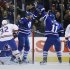 Toronto Maple Leafs' McLaren celebrates goal with McClement in front of Montreal Canadiens' Moen and White during NHL hockey game in Toronto