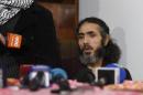 Former Guantanamo detainee Syrian Abu Wa'el Dhiab, speaks during a press conference in his apartment in Montevideo, Uruguay, Friday, Sept. 30, 2016, where he said he is going to stop drinking water on Monday, to press officials into speeding up his relocation to another country. Uruguay's government says it is searching for another country to take Dhiab. Dhiab, who is currently on a hunger strike, says they are taking too long to relocate him. (AP Photo/Matilde Campodonico)