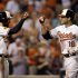 Baltimore Orioles' Chris Davis, right, fist-bumps teammate Nick Markakis after driving him in on a home run in the seventh inning of an interleague baseball game against the Washington Nationals, Wednesday, May 29, 2013, in Baltimore. Baltimore won 9-6. (AP Photo/Patrick Semansky)