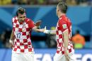 Croatia's Mario Mandzukic, left, celebrates with Croatia's Ivica Olic after scoring his side's third goal during the group A World Cup soccer match between Cameroon and Croatia at the Arena da Amazonia in Manaus, Brazil, Wednesday, June 18, 2014. (AP Photo/Themba Hadebe)