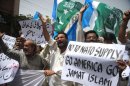 Activists of Pakistani political and Islamic party Jammat-e-Islami (JI) shout slogans during a protest