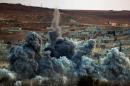 An explosion following an airstrike is seen in the Syrian town of Kobani from near the Mursitpinar border crossing on the Turkish-Syrian border in the southeastern town of Suruc