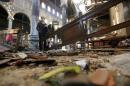 Damage from the explosion inside Cairo's Coptic Orthodox Cathedral is seen inside the cathedral in Cairo
