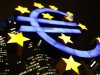 An illuminated euro sign is seen in front of the headquarters of the European Central Bank in Frankfurt