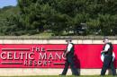 Armed police officers stand guard outside The Celtic Manor Resort, the venue for the upcoming NATO summit, in Newport, south Wales, on September 2, 2014