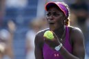 Stephens of the U.S. reacts after hitting a ball into the crowd after her win over compatriot Hampton at the U.S. Open tennis championships in New York