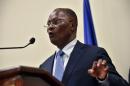 Haitian provisional President Jocelerme Privert speaks after receiving a special commission's investigative report on the 2015 Haitian election at the National Palace in Port-au-Prince on May 30, 2016