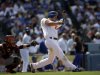 Los Angeles Dodgers' Clayton Kershaw hits a home run against the San Francisco Giants during the eighth inning of a season-opening baseball game in Los Angeles, Monday, April 1, 2013. (AP Photo/Jae C. Hong)
