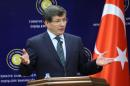 Turkish Foreign Minister Ahmet Davutoglu speaks during a press conference in Ankara on October 7, 2013