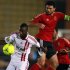 Ghaly of Al Ahly fights for the ball with Cisse of Zamalek during their CAF Champions League soccer match in Cairo