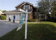 Realtor Bolin shows a home to Amy and Eddie Deon in Riverside, California May 24, 2012. REUTERS/Alex Gallardo