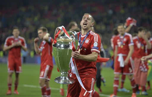 Bayern Munich's Franck Ribery of France lifts the trophy after his team won the Champions League Final soccer match against Borussia Dortmund at Wembley Stadium in London, Saturday May 25, 2013