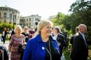 Norway's main opposition leader Erna Solberg of Hoyre smiles as she greets the media in front of the Parliament building in Oslo
