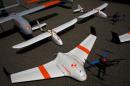 FireFlight UAS unmanned aerial vehicles TwinHawk, Scout, Flanker, and Hawkeye 400, are displayed on the tarmac during "Black Dart" at Naval Base Ventura County Sea Range, Point Mugu