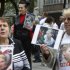 Opposition supporters hold placards displaying jailed former prime minister Tymoshenko during a rally near the court in Kiev