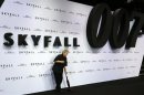 Employee cleans red carpet before German premiere for the film 'Skyfall' in Berlin