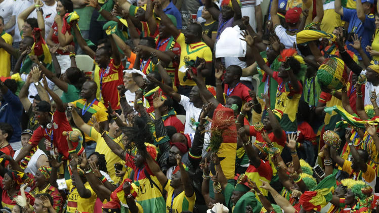 Ghana fans celebrate on the tribune after their team scored during the group G World Cup soccer match between Germany and Ghana at the Arena Castelao in Fortaleza, Brazil, Saturday, June 21, 2014. (AP Photo/Themba Hadebe)