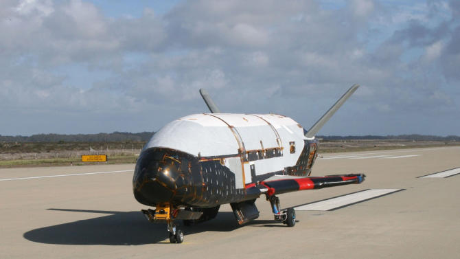 This June 2009 photo made available by the U.S. Air Force via NASA shows the X-37B Orbital Test Vehicle at Vandenberg Air Force Base, Calif. On Wednesday, May 20, 2015, the Air Force launched its unmanned mini-shuttle from Cape Canaveral, Fla. Like the old shuttle, the X-37B launches vertically and lands horizontally, is reusable, and has lots of room for experiments. But no one flies on them; they are operated robotically. (U.S. Air Force via AP)