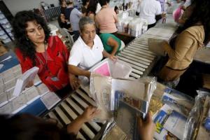 Employees pack electoral material and ballots in boxes&nbsp;&hellip;