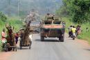 French soldiers of the Sangaris operation patrol in military vehicles on the Boali road near Bangui on December 6, 2014