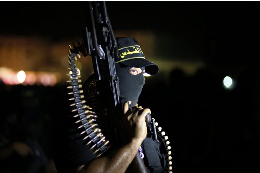 An Islamic Jihad militant marches during an anti-Israel military show in Gaza