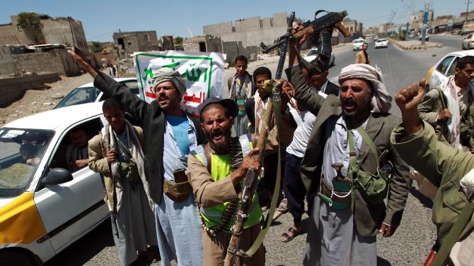 Shiite Huthi anti-government rebels man a checkpoint on the outskirts of Sanaa on September 21, 2014