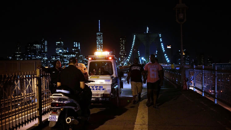 Police officers patrol the Brooklyn Bridge on August 25, 2014 in New York City