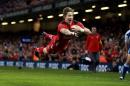 Wales' Liam Williams scores their first try during the Six Nations rugby union match between Wales and Scotland at the Millennium Stadium, Cardiff, Wales, Saturday, March 15, 2014. (AP Photo/David Davies, PA Wire) UNITED KINGDOM OUT - NO SALES - NO ARCHIVES