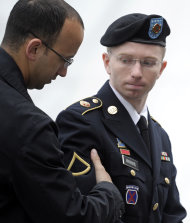 Army Pfc. Bradley Manning, right, is escorted into a courthouse at Fort Mead, Md., for the fourth day of his court martial. Monday, June 10, 2013. Manning is charged with indirectly aiding the enemy by sending troves of classified material to WikiLeaks. He faces up to life in prison. (AP Photo/Cliff Owen)
