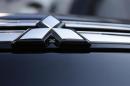 The logo of Mitsubishi Motors is seen on the front part of the company's car at the company showroom in Tokyo