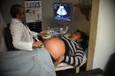 A pregnant woman gets an ultrasound at a maternity in Guatemala City on February 2, 2016 as a surge of microcephaly cases in Latin America continues