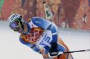 Norway's Aksel Lund Svindal finishes the slalom portion of the men's supercombined at the Sochi 2014 Winter Olympics, Friday, Feb. 14, 2014, in Krasnaya Polyana, Russia. (AP Photo/Gero Breloer)