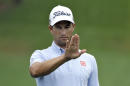 Adam Scott, of Australia, uses his hand to line up a putt on the 10th hole during the first round of the Valspar Championship golf tournament, Thursday, March 12, 2015, at Innisbrook in Palm Harbor, Fla. (AP Photo/Chris O'Meara)