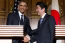President Barack Obama, left, and Japanese Prime Minister Shinzo Abe shake hands at the conclusion of their joint news conference at the Akasaka State Guest House in Tokyo, Thursday, April 24, 2014. Obama said Thursday that he wants to see a dispute between China and Japan over islands in the East China Sea resolved peacefully, while affirming that America's mutual security treaty with Japan applies to the islands. (AP Photo/Carolyn Kaster)
