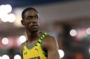 Kemar Bailey-Cole of Jamaica looks back after winning the men's 100 meter race at Hampden Park stadium during the Commonwealth Games 2014 in Glasgow, Scotland, Monday July 28, 2014. (AP Photo/ Scott Heppell)