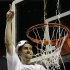 Mississippi guard Marshall Henderson (22) prepares to cut part of the net after Mississippi  defeated Florida during the second half of an NCAA college basketball game in the final round of the Southeastern Conference tournament, Sunday, March 17, 2013, in Nashville, Tenn. Mississippi  won 66-63. (AP Photo/Dave Martin)
