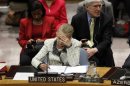 U.S. Secretary of State Clinton reads her notes during Security Council meeting in New York