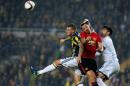 Manchester United's Zlatan Ibrahimovic (C) vies with Fenerbahce's Martin Skrtel (L) and goalkeeper Volkan Demirel (R) on November 3, 2016 in Istanbul