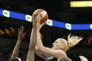 Seattle Storm forward Lauren Jackson (15) goes up for a shot against Minnesota Lynx forward Rebekkah Brunson (32) and guard Lindsay Whalen (13) during the second half of Game 1 of the WNBA basketball first-round playoff series Friday, Sept. 28, 2012, in Minneapolis. The Lynx won 78-70. (AP Photo/Stacy Bengs)