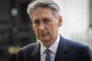 Britain's Foreign Secretary Philip Hammond leaves Downing Street, central London, on August 20, 2014, after a meeting to discuss the ongoing crisis involving the Islamic State radical group