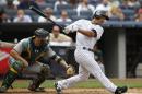 New York Yankees' Cole Figueroa (40), called up from Triple-A Scranton Wilkes-Barre Thursday morning, hits a fourth-inning double in a baseball game against the Oakland Athletics at Yankee Stadium in New York, Thursday, July 9, 2015. (AP Photo/Kathy Willens)