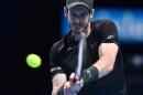 Britain's Andy Murray returns to Croatia's Marin Cilic during their round robin stage men's singles match on day two of the ATP World Tour Finals tennis tournament in London on November 14, 2016