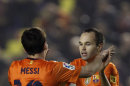 Barcelona's Lionel Messi from Argentina is congratulated by teammate Andres Iniesta, right, after scoring a goal against Levante during their la liga soccer match at the Ciutat Valencia stadium in Valencia, Spain, Sunday, Nov. 25, 2012.(AP Photo/ Alberto Saiz)