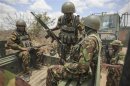Handout photo shows soldiers of the Kenyan contingent serving with AMISOM boarding a resupply convoy vehicle in Dhobley