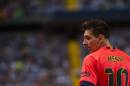 FC Barcelona's Lionel Messi from Argentina, during a Spanish La Liga soccer match between Malaga and Barcelona at La Rosaleda stadium in Malaga, Spain, Wednesday, Sept. 24, 2014. (AP Photo/Daniel Tejedor)