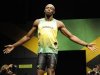 Jamaican sprinter Usain Bolt models the Jamaican team's kit for the London 2012 Olympic Games, in London
