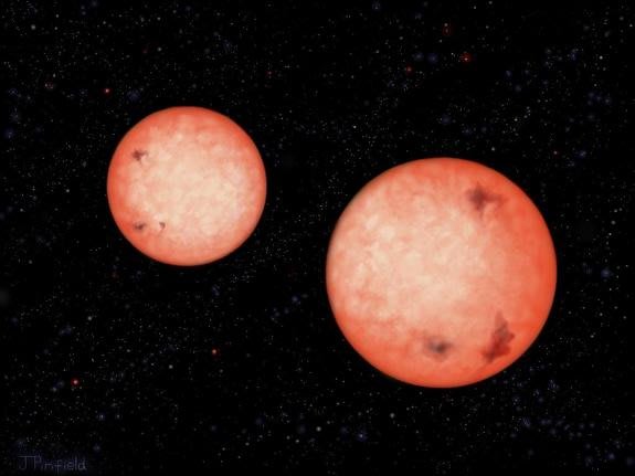 This artist's impression shows two active stars — M4-type red dwarfs — that orbit each other every 2.5 hours, as they continue to spiral inwards. Eventually they will coalesce into a single star.