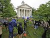 Reporters work on the front lawn of the Centre County Courthouse in Bellefonte, Pa., Monday, June 4, 2012, a day before the start of the child sexual abuse trial of former Penn State college football assistant coach Jerry Sandusky. Jury selection is scheduled to begin Tuesday. (AP Photo/Gene J. Puskar)