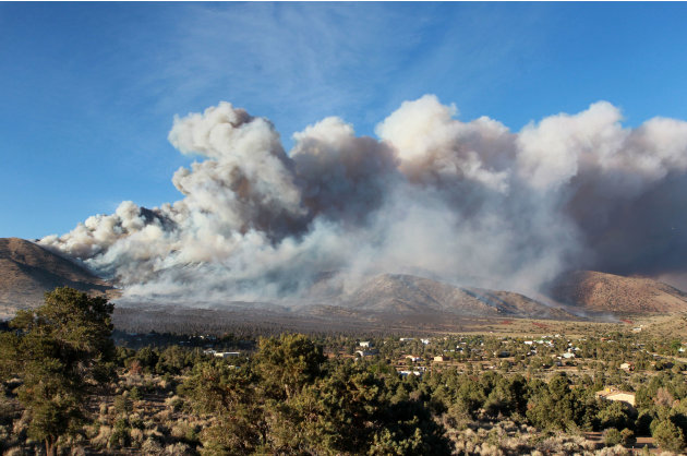 CORRECTS NUMBER OF HOMES DESTROYED - Firefighters battle a wind-driven fire that has destroyed at least two homes and a number of outbuildings in Topaz Ranch Estates, south of Gardnerville, Nev., on T